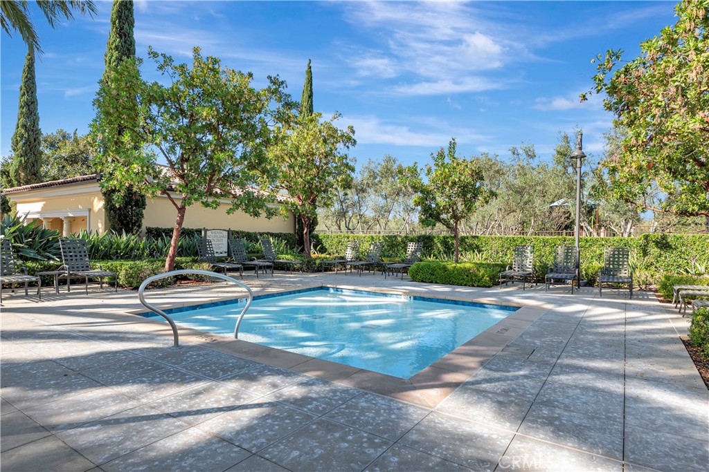 110 Mosswood Irvine, CA 92620 - Photo 31 of 38 a view of a street with houses and a street view