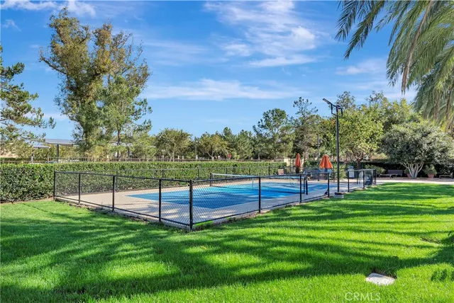 a view of swimming pool from a garden