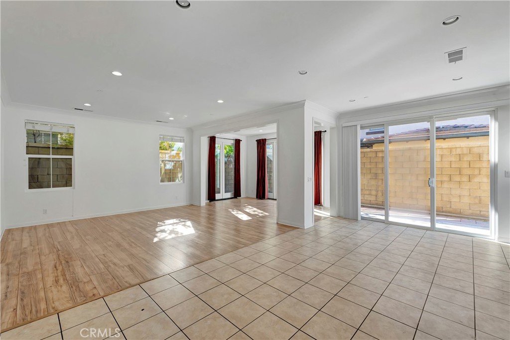 110 Mosswood Irvine, CA 92620 - Photo 5 of 38 a view of an empty room with window and chandelier