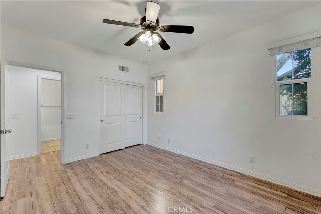 110 Mosswood Irvine, CA 92620 - Photo 10 of 38 a view of empty room with wooden floor