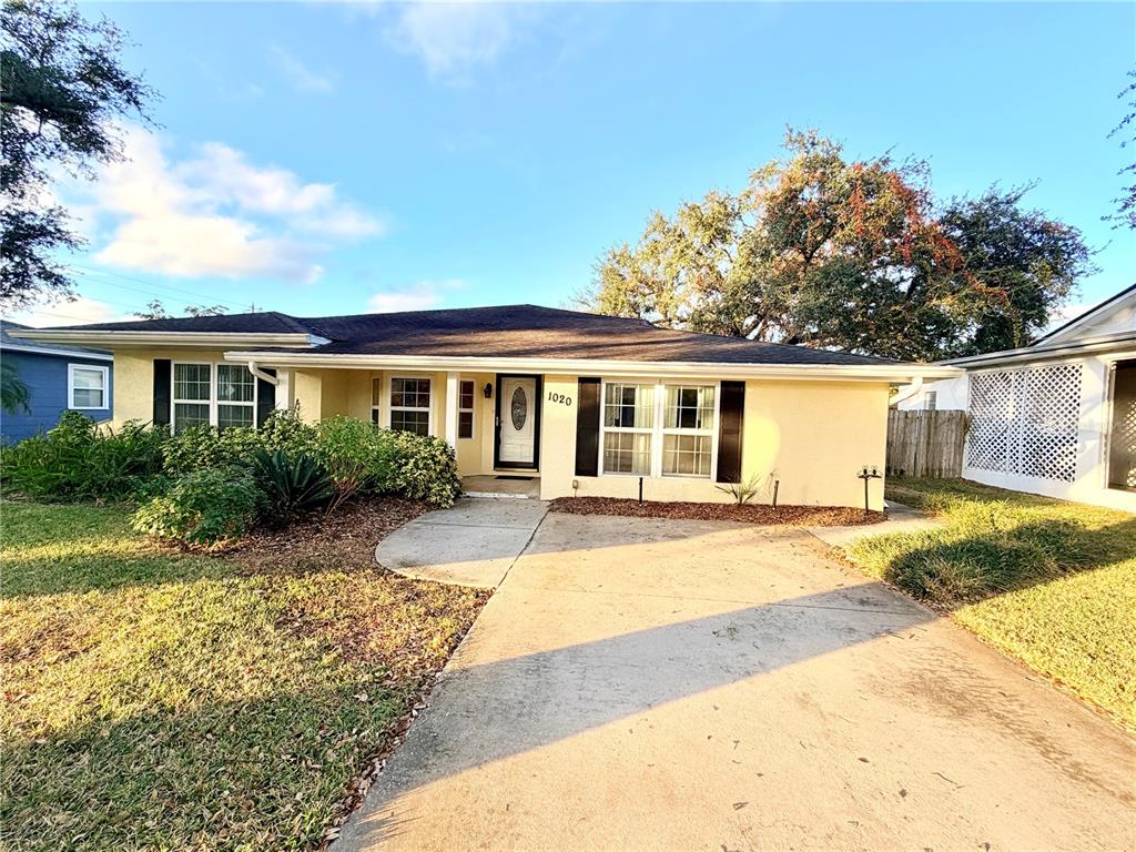 front view of a house next to a yard