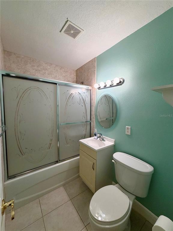 1020 2nd Avenue Northwest Largo, FL 33770 - Photo 14 of 37 a bathroom with a toilet a sink and mirror