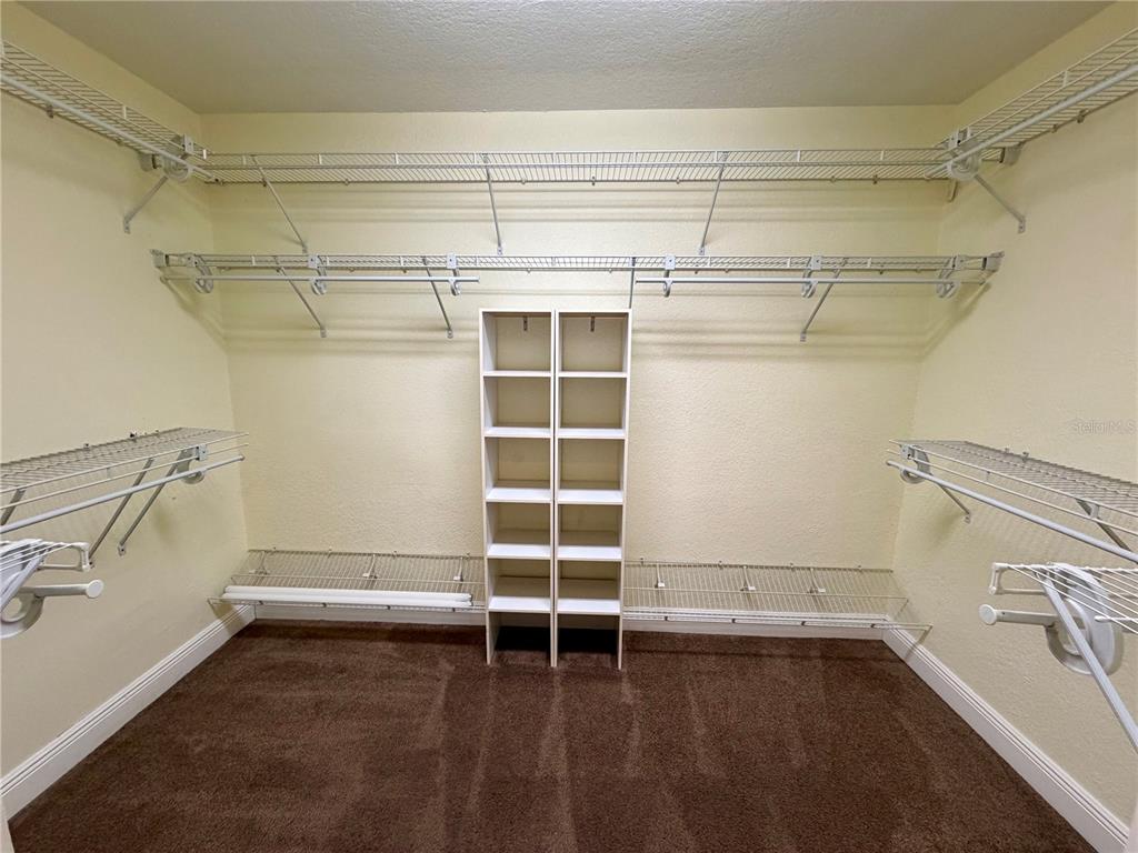 1020 2nd Avenue Northwest Largo, FL 33770 - Photo 16 of 37 a view of walk in closet with empty racks