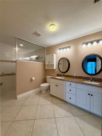 a bathroom with a shower and a shower