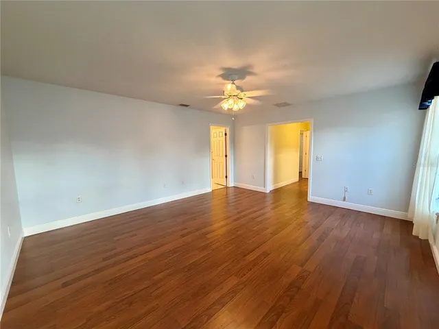 a kitchen with stainless steel appliances a sink a stove a refrigerator and cabinets