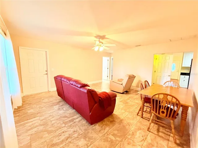a bedroom with furniture and a rug