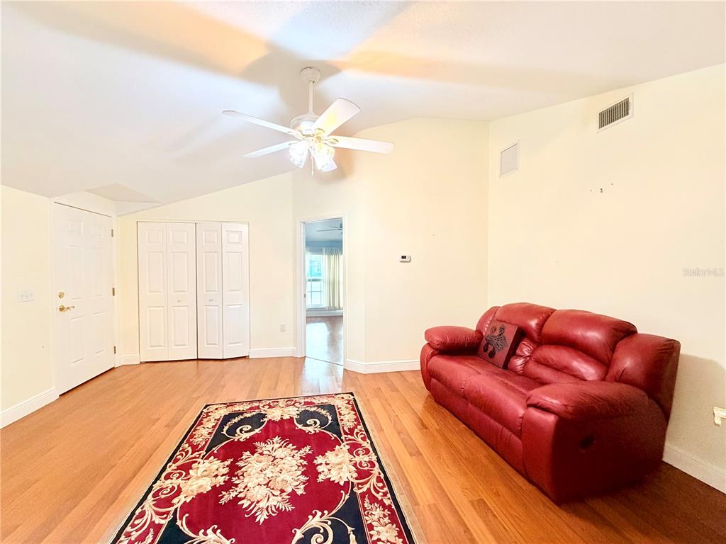 1020 2nd Avenue Northwest Largo, FL 33770 - Photo 30 of 37 a bedroom with furniture and a rug