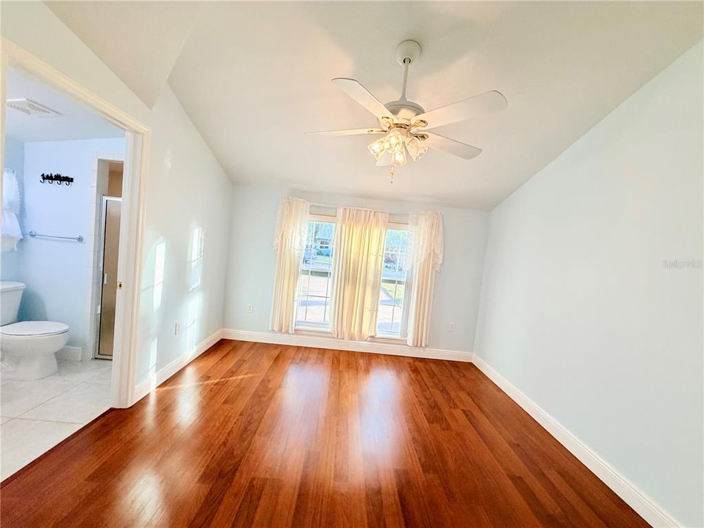 1020 2nd Avenue Northwest Largo, FL 33770 - Photo 32 of 37 a view of an empty room with wooden floor and a window