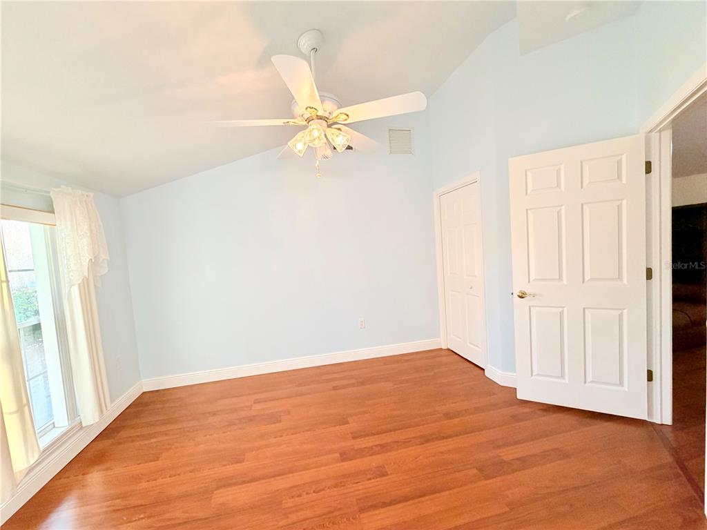1020 2nd Avenue Northwest Largo, FL 33770 - Photo 33 of 37 a view of a room with wooden floor and a ceiling fan