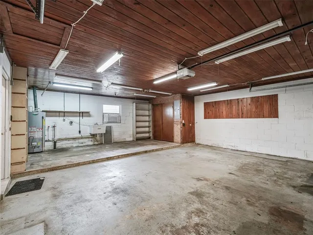 a view of empty room with wooden ceiling