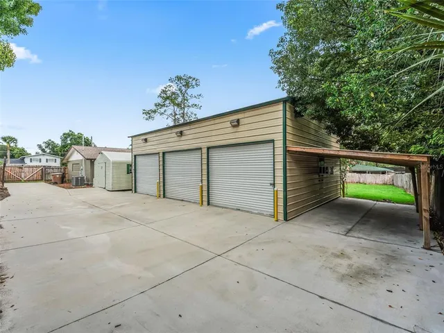 a view of a parking space in a backyard