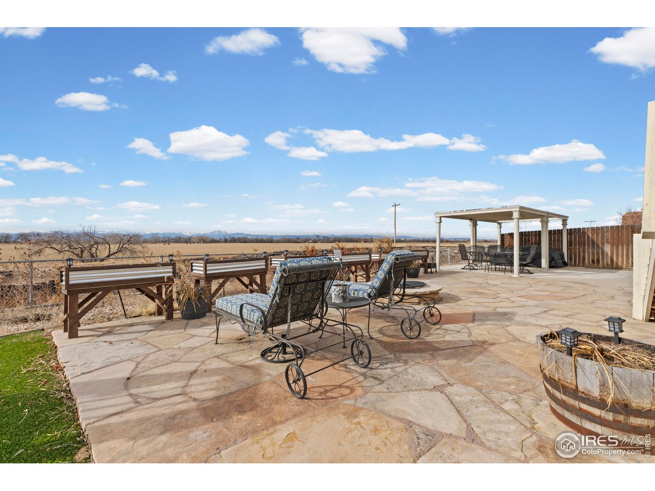 765 Rodgers Circle Platteville, CO 80651 - Photo 31 of 45 Huge flagstone patio with built-in firepit!
