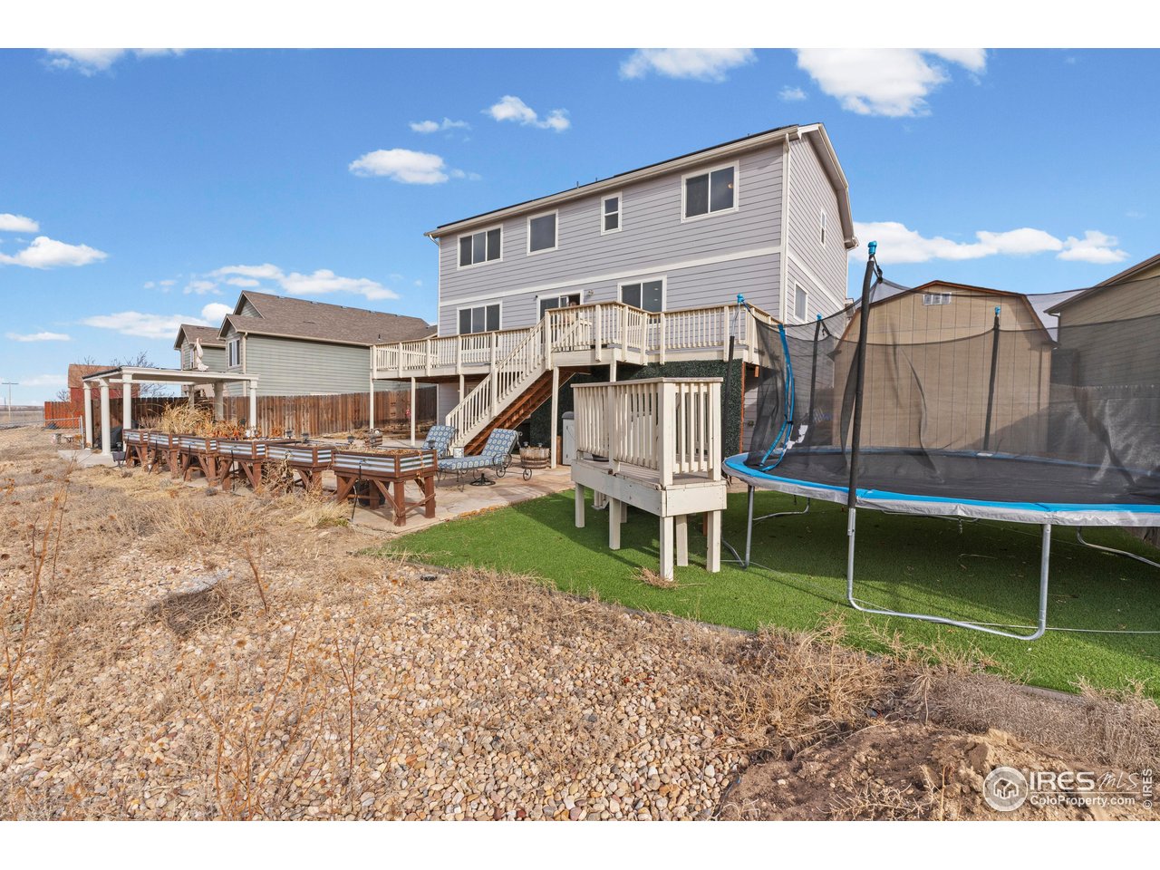 765 Rodgers Circle Platteville, CO 80651 - Photo 37 of 45 Trampoline over artificial turf grass and play deck included!