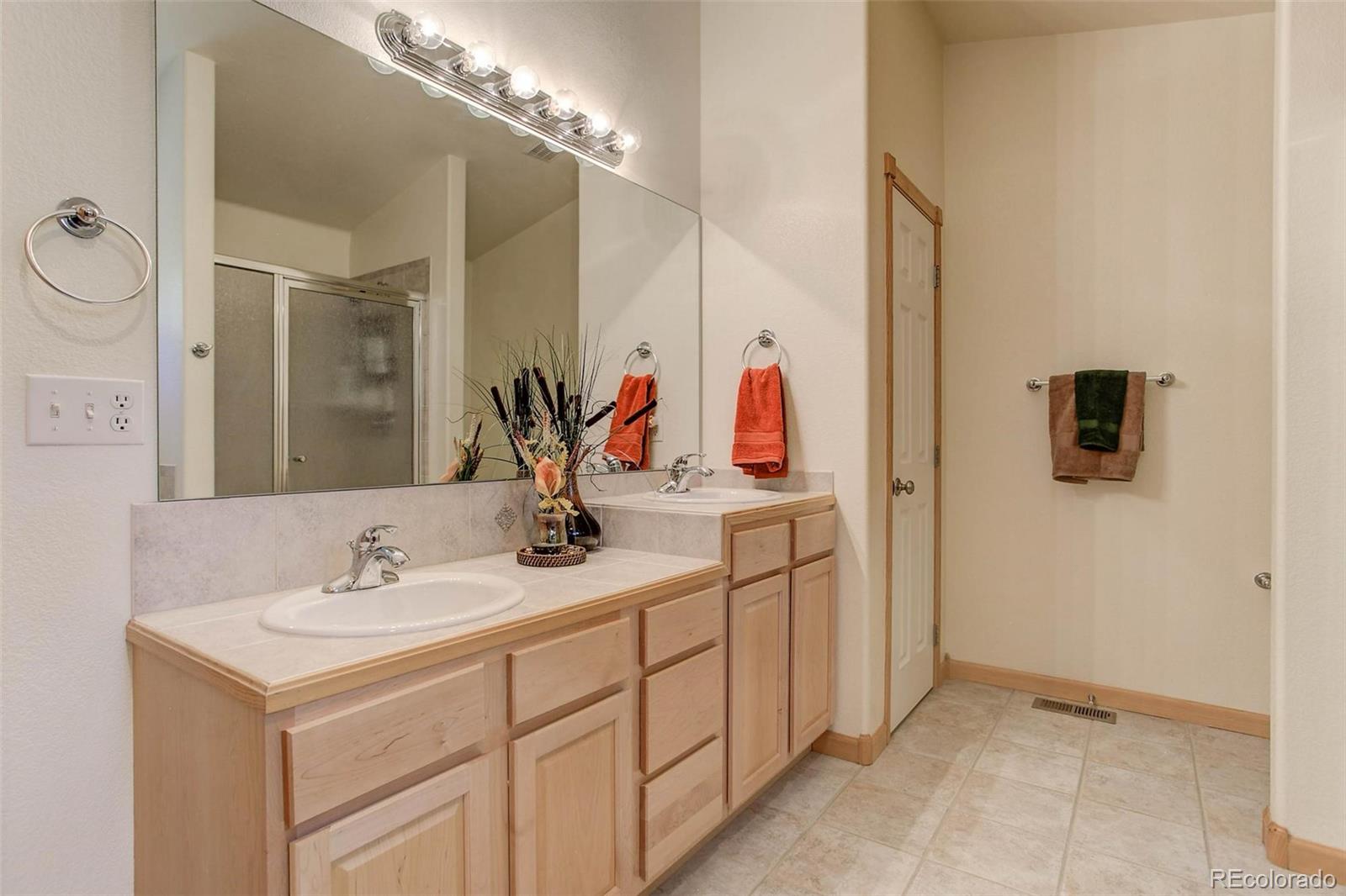 29 Pine Trail Bailey, CO 80421 - Photo 14 of 30 a bathroom with a sink and a mirror