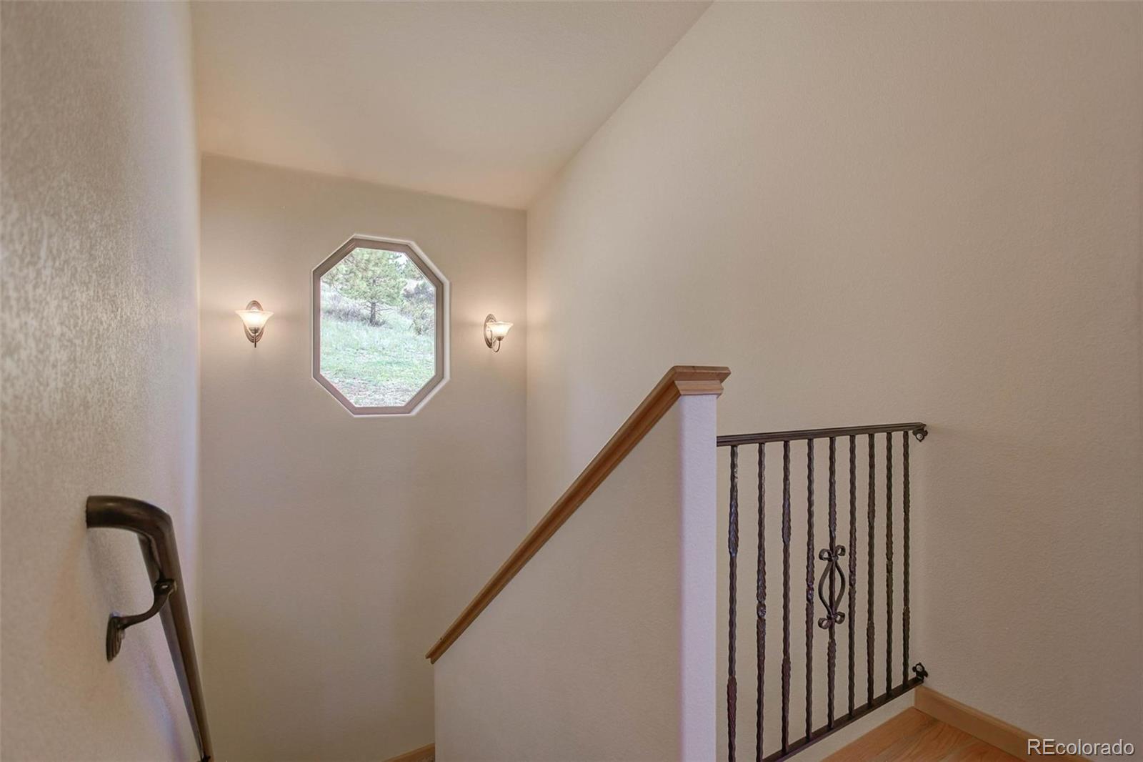 29 Pine Trail Bailey, CO 80421 - Photo 19 of 30 a view of a hallway with windows