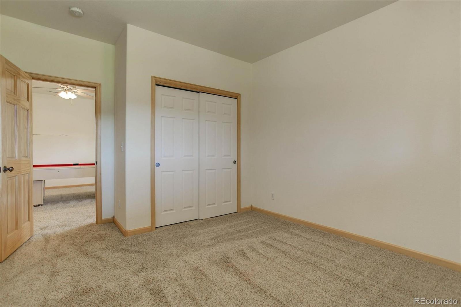 29 Pine Trail Bailey, CO 80421 - Photo 22 of 30 an empty room with mirror