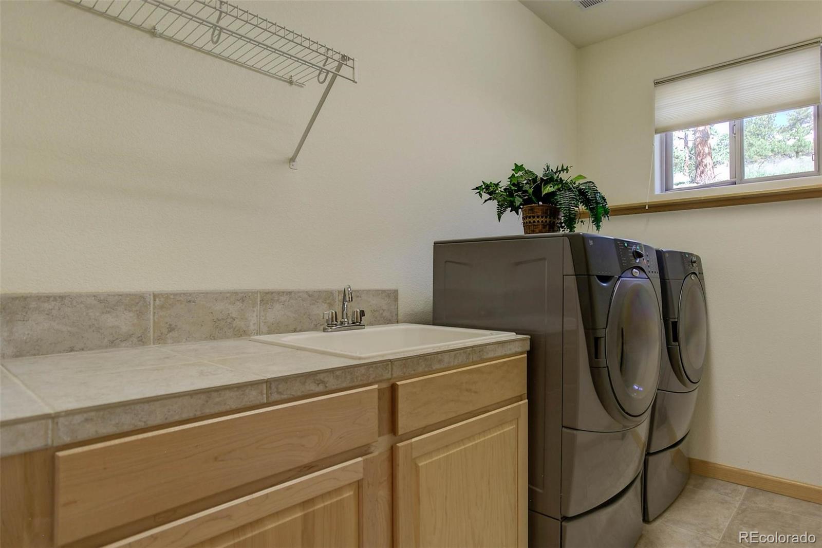 29 Pine Trail Bailey, CO 80421 - Photo 23 of 30 a utility room with dryer and washer
