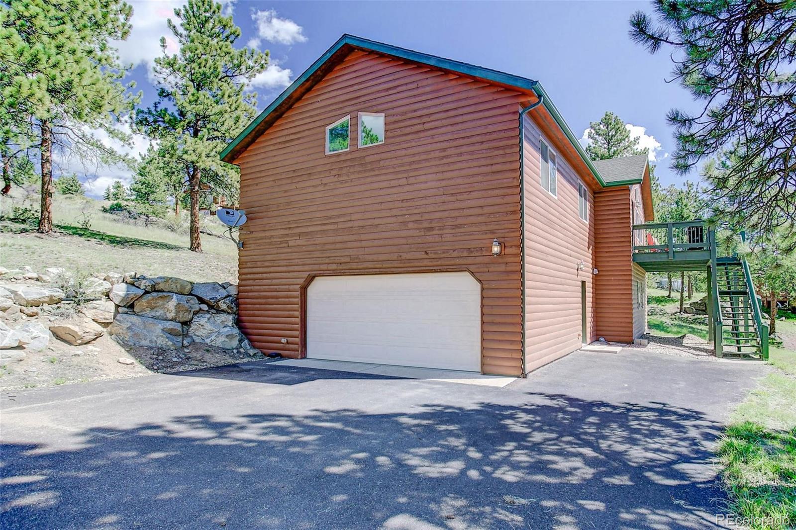 29 Pine Trail Bailey, CO 80421 - Photo 3 of 30 a view of a house with a yard
