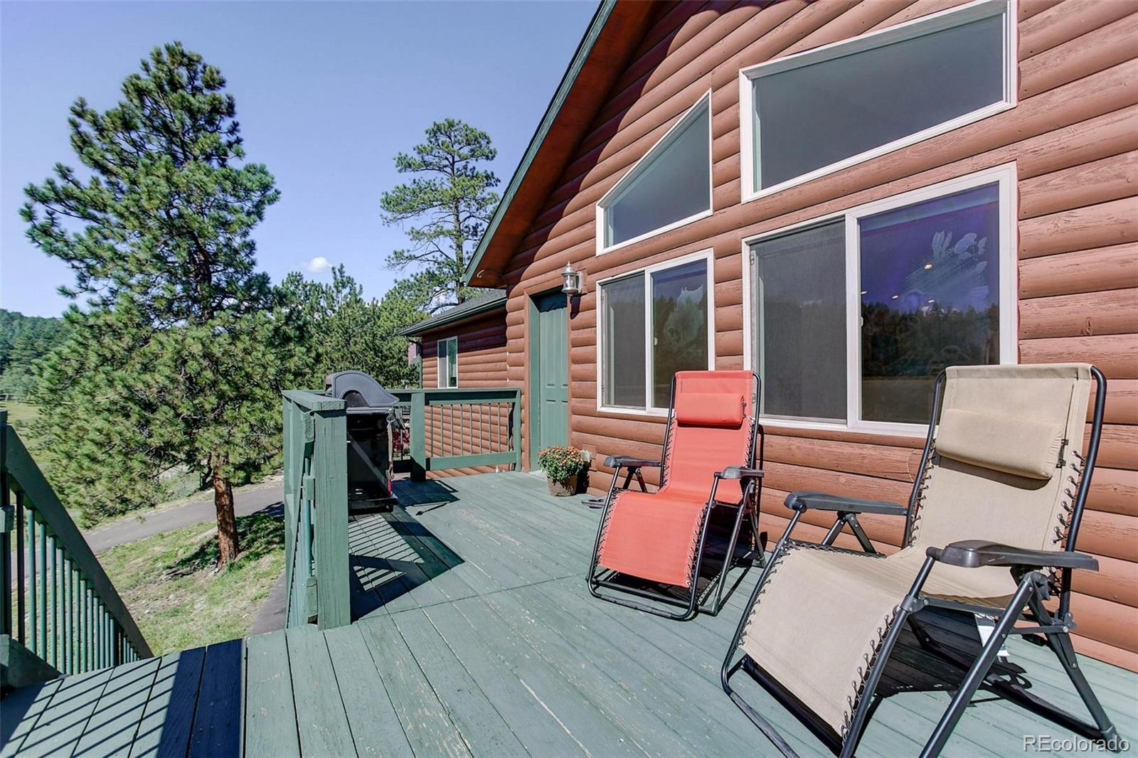 29 Pine Trail Bailey, CO 80421 - Photo 5 of 30 a view of living room with couch and chairs