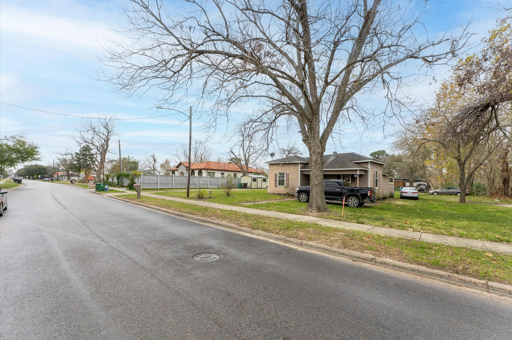 6415 Knox Street Houston, TX 77091 - Photo 4 of 12 a view of road with large trees
