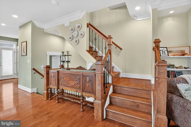 a view of entryway livingroom and hall with wooden floor