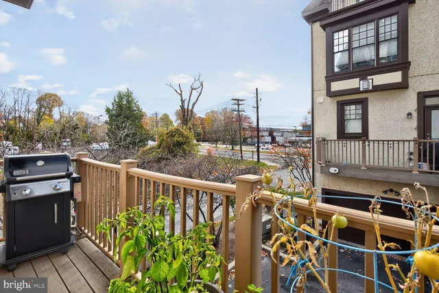 a view of a balcony with wooden floor
