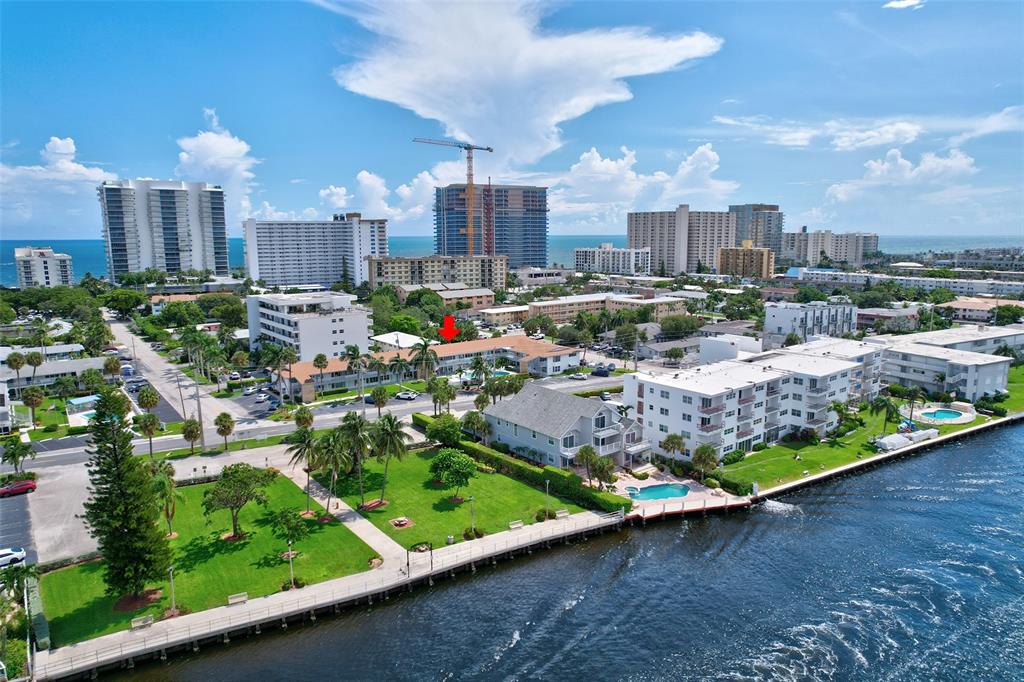 1110 North Riverside Drive, Unit 14 Pompano Beach, FL 33062 - Photo 11 of 56 ARROW is pointing at the BUILDING NOT THE UNIT! This Lifestyle is waiting for you! If you Love, Sun, Beaches, Fun, Entertaining, Beaches, Dining, Shopping, this Unit is near it all! WOW checkout the Beautiful Mature Landscape! Assessment Work Completed & Building Repainted Sept.2024!