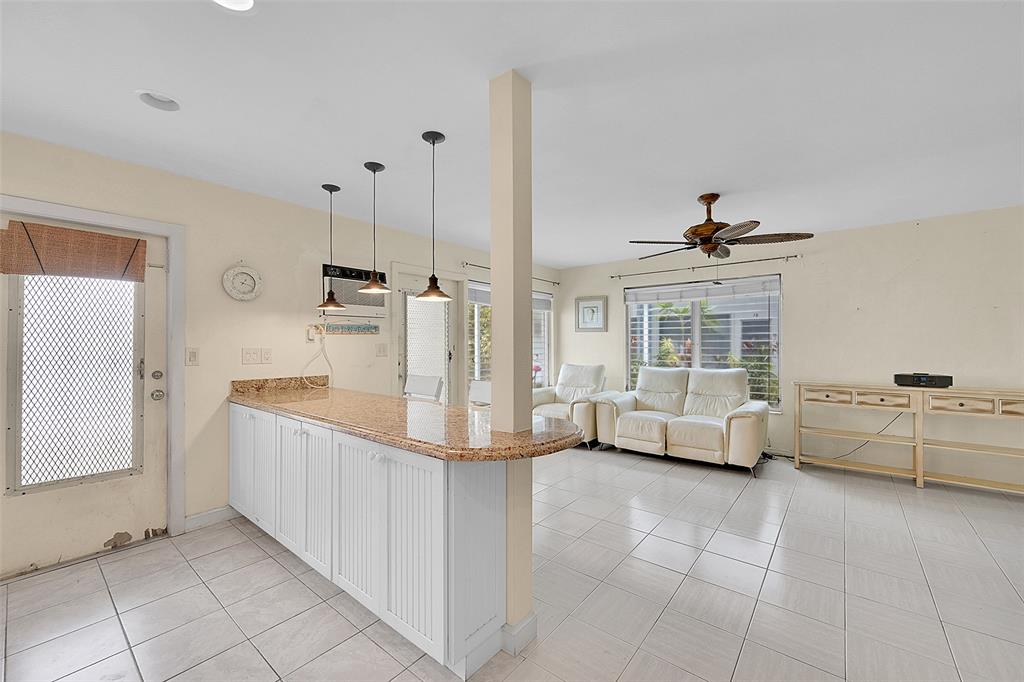 1110 North Riverside Drive, Unit 14 Pompano Beach, FL 33062 - Photo 21 of 56 Your Updated and Open Kitchen with Snack Bar Flows Beautifully into the Living Room which You Will See Also Include POOLSIDE VIEWS. If you Love To Entertain Guests You Will Love This Unit's Layout!