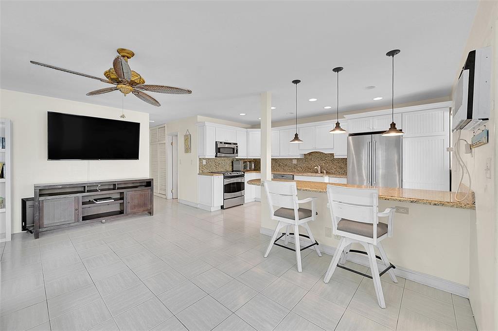 1110 North Riverside Drive, Unit 14 Pompano Beach, FL 33062 - Photo 22 of 56 If you Love To Entertain Guests You Will Love This Unit's Layout! Your Updated and Open Kitchen with Snack Bar Flows Beautifully into the Living Room which You Will See Also Include POOLSIDE VIEWS and is Ready For Your Personal Touches. Welcome Home!