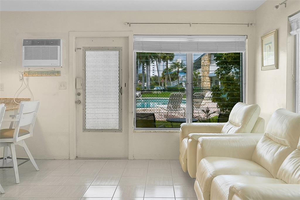 1110 North Riverside Drive, Unit 14 Pompano Beach, FL 33062 - Photo 25 of 56 Imagine This is Your Future Living Room with These Beautiful POOL SIDE VIEWS. Relax, Unwind, Entertain, Read and Enjoy Your Guests Living In This 1st Floor Corner Unit, POOL SIDE.