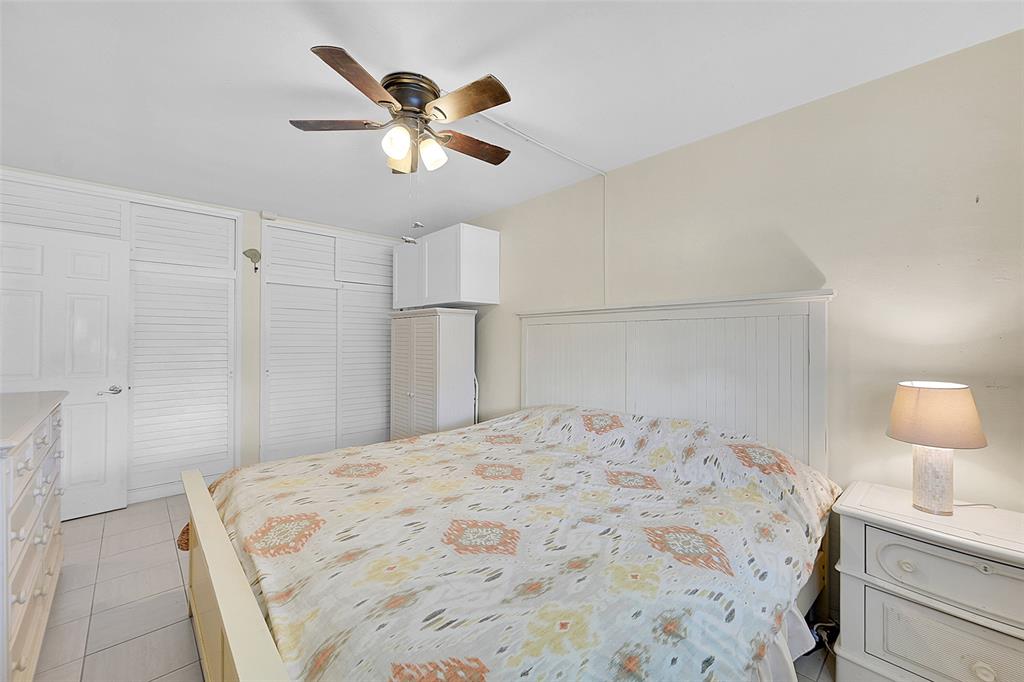 1110 North Riverside Drive, Unit 14 Pompano Beach, FL 33062 - Photo 26 of 56 Primary Bedroom is so Spacious there is Even Room for a Reading Nook or Desk. 1st Floor Primary Bedroom is Bright with Southern Exposure, Bright with Lots Of Closet Spaces.