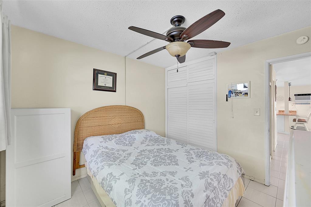 1110 North Riverside Drive, Unit 14 Pompano Beach, FL 33062 - Photo 29 of 56 Guest Bedroom is Perfect for Guests for a Craft Room or Media Room. Your will Guests will Love Waking Up to the Morning Sun. 1st Floor Guest Bedroom is Bright with Southern Exposure, Bright with Lots Of Closet Spaces.