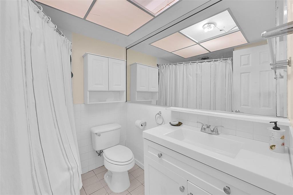 1110 North Riverside Drive, Unit 14 Pompano Beach, FL 33062 - Photo 5 of 56 Your 1st Floor Unit has a Spacious Bathroom with an oversized tub and is ready for you to make it your own. The Bathroom is conveniently located in the Hallway Before Both Bedrooms which is Perfect When Entertaining.