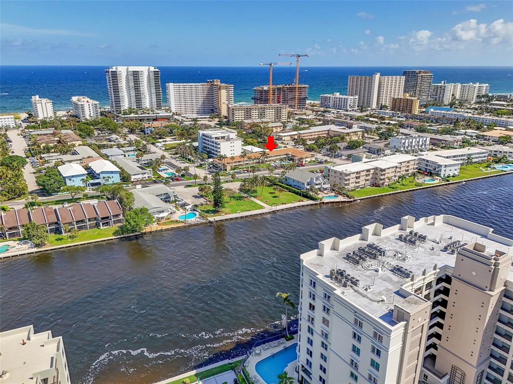 1110 North Riverside Drive, Unit 14 Pompano Beach, FL 33062 - Photo 54 of 56 Check Out Your Condo which directly across from the INTRACOASTAL & WATERFRONT PARK. You can rent IMMEDIATELY from 3-6 months up to 4 times per year & is renewable with association review and approval. Arrow is pointing at the BUILDING NOT THE UNIT!