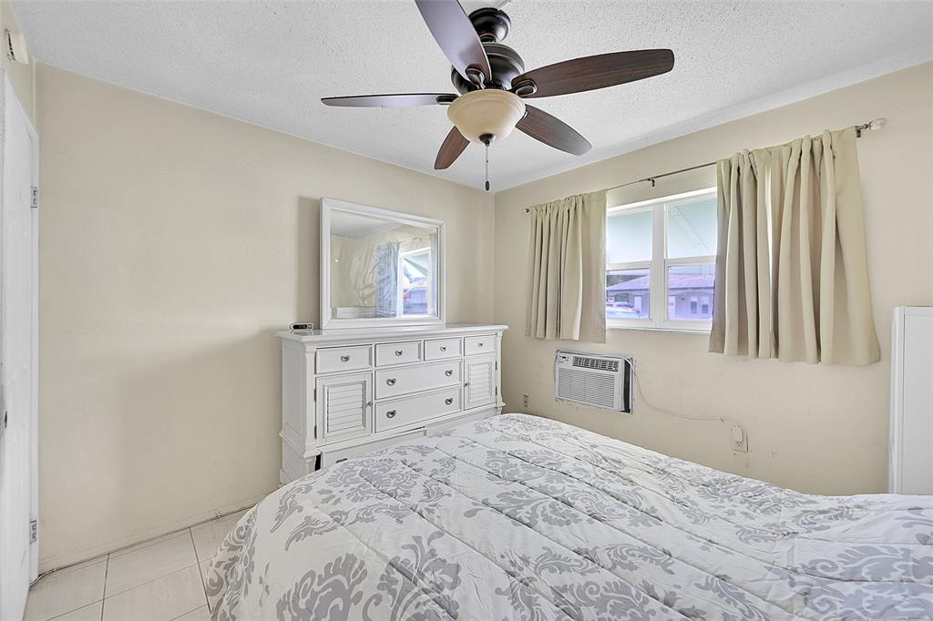 1110 North Riverside Drive, Unit 14 Pompano Beach, FL 33062 - Photo 6 of 56 1st Floor Guest Bedroom is Bright with Southern Exposure, Bright with Lots Of Closet Spaces. Guest Bedroom is Perfect for Guests for a Craft Room or Media Room. Your will Guests will Love Waking Up to the Morning Sun.