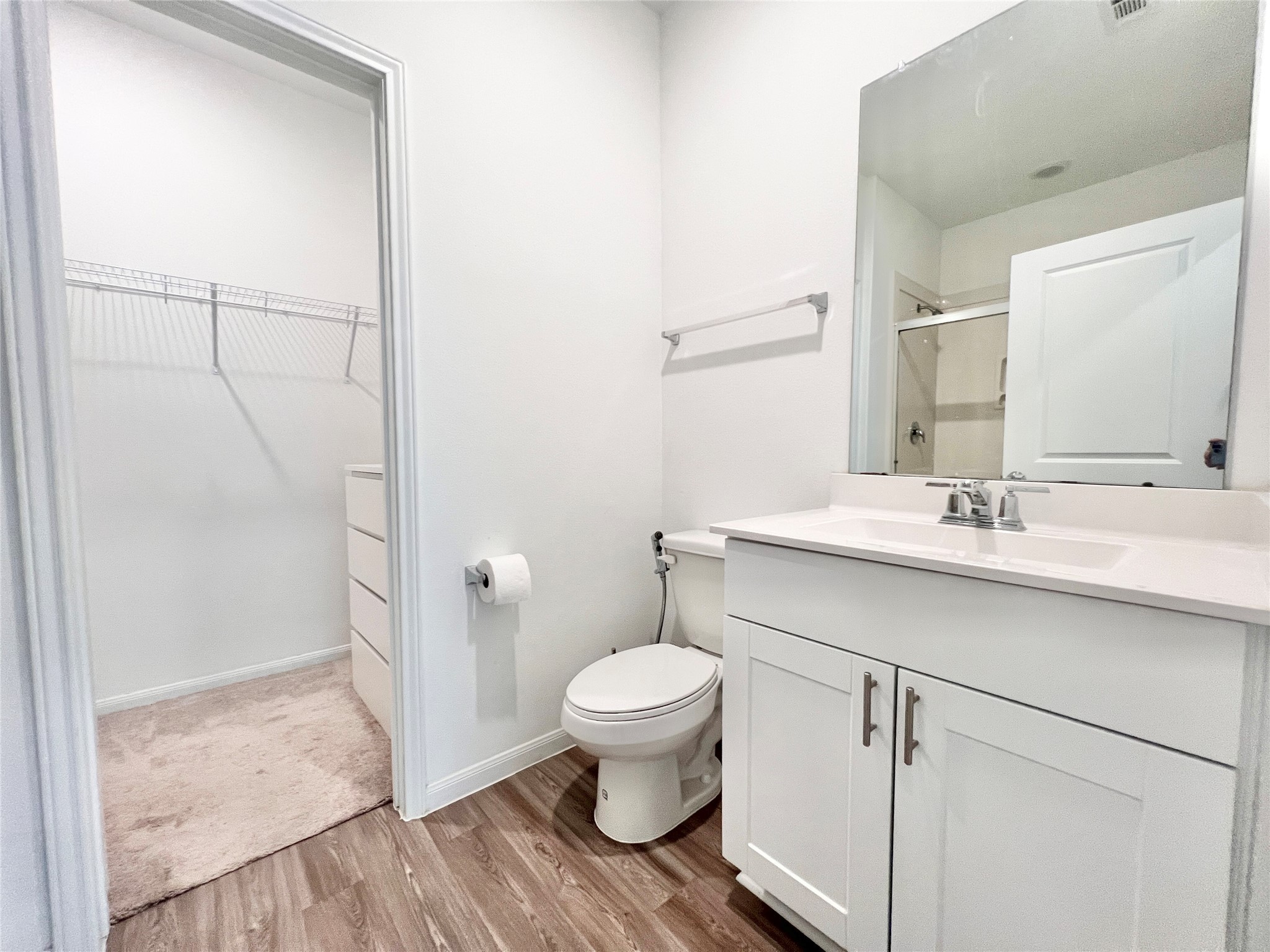 17835 Plow Horse Lane Hockley, TX 77447 - Photo 14 of 41 a bathroom with a toilet sink and a mirror