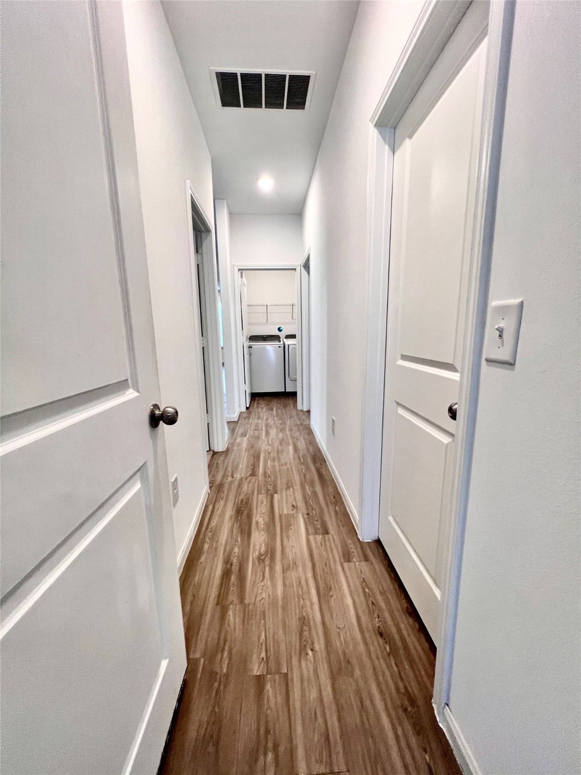 17835 Plow Horse Lane Hockley, TX 77447 - Photo 26 of 41 a view of a hallway with wooden floor