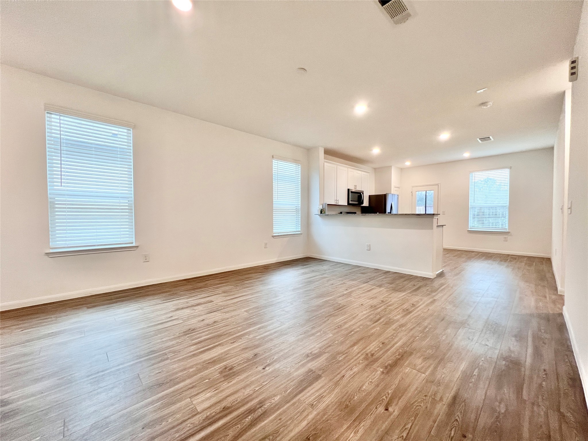 17835 Plow Horse Lane Hockley, TX 77447 - Photo 4 of 41 a view of a kitchen with a sink and a stove top oven