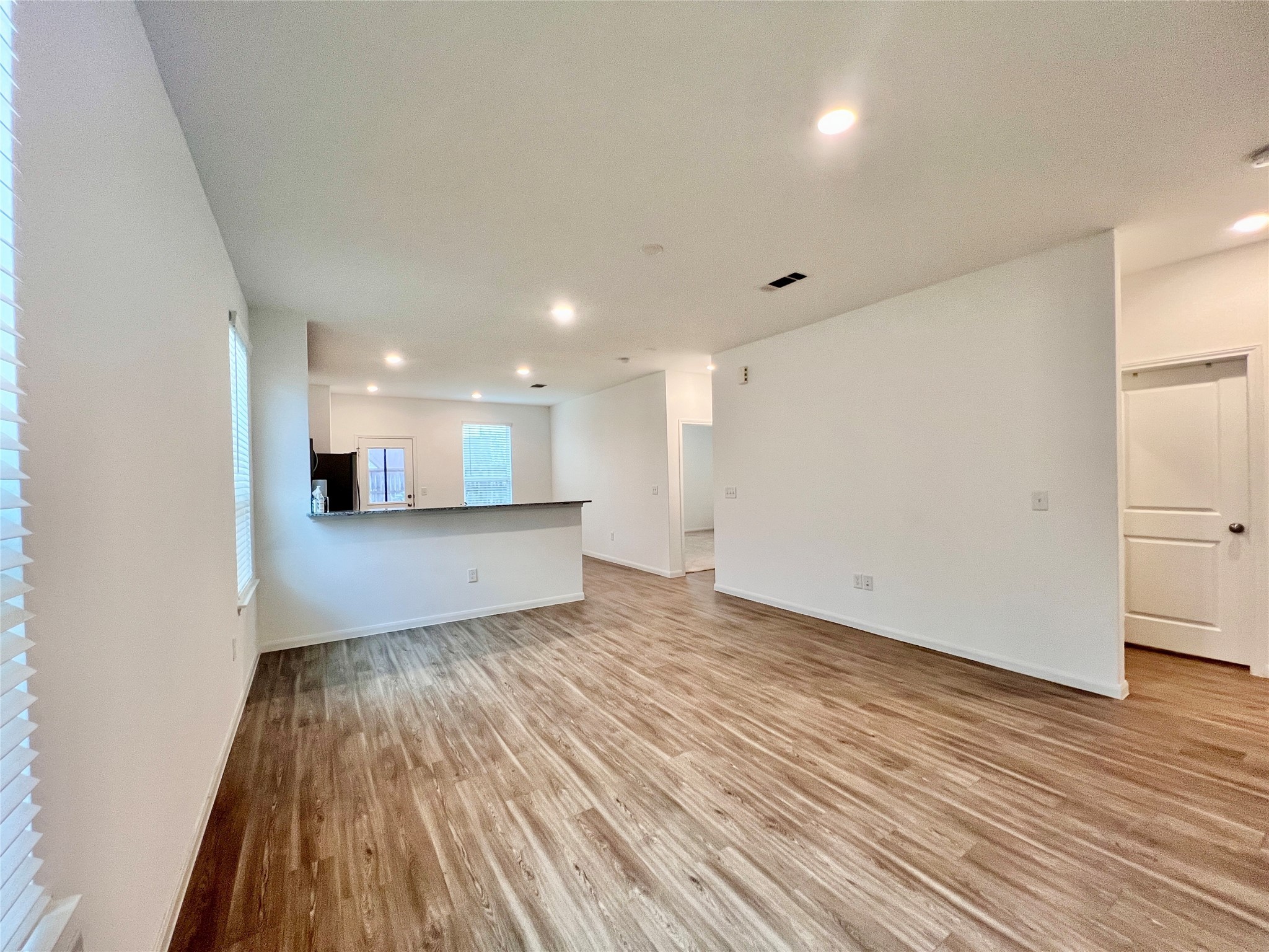 17835 Plow Horse Lane Hockley, TX 77447 - Photo 5 of 41 a view of a big room with wooden floor and windows