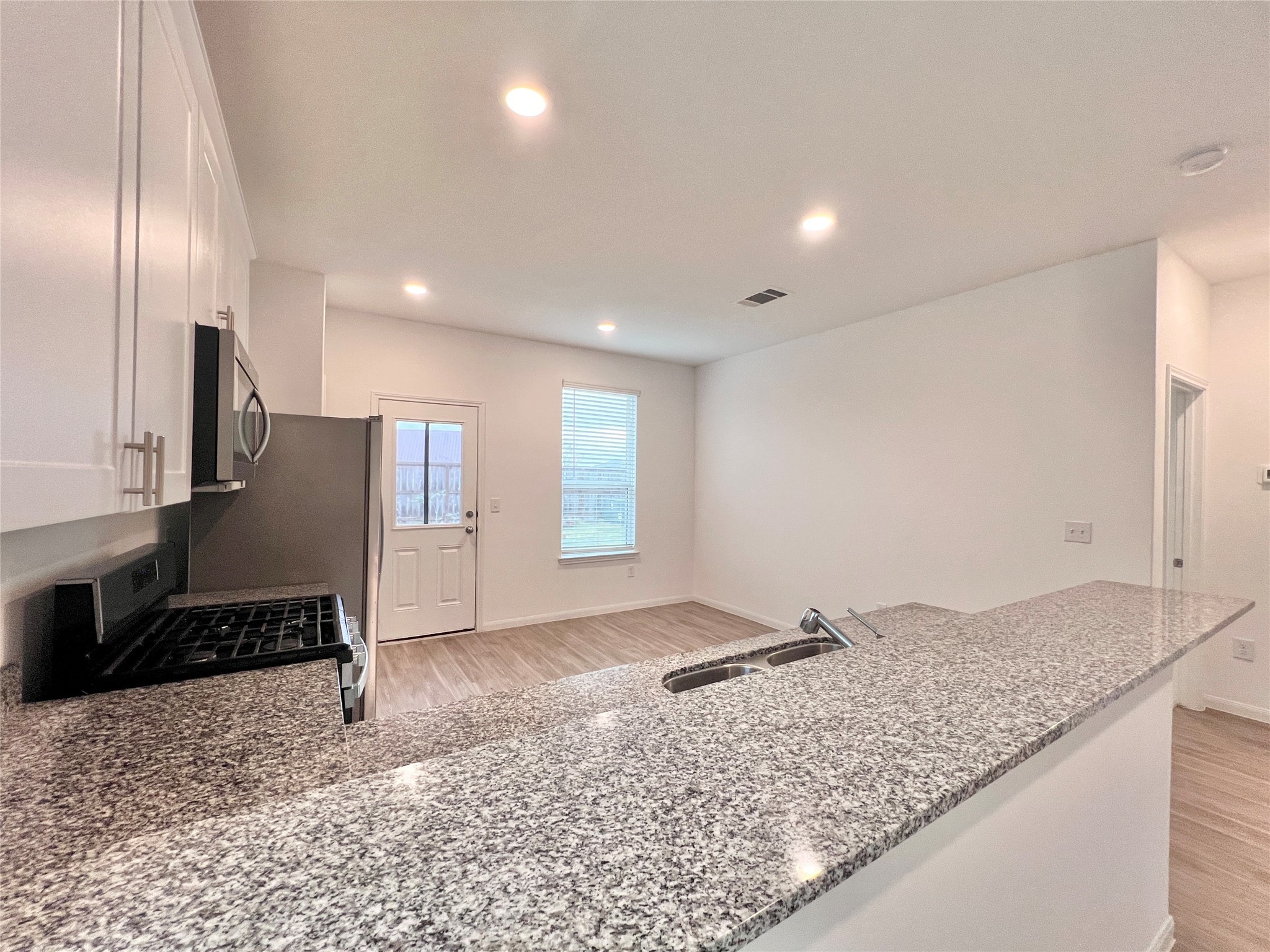 17835 Plow Horse Lane Hockley, TX 77447 - Photo 7 of 41 a view of a refrigerator in kitchen and granite counter top