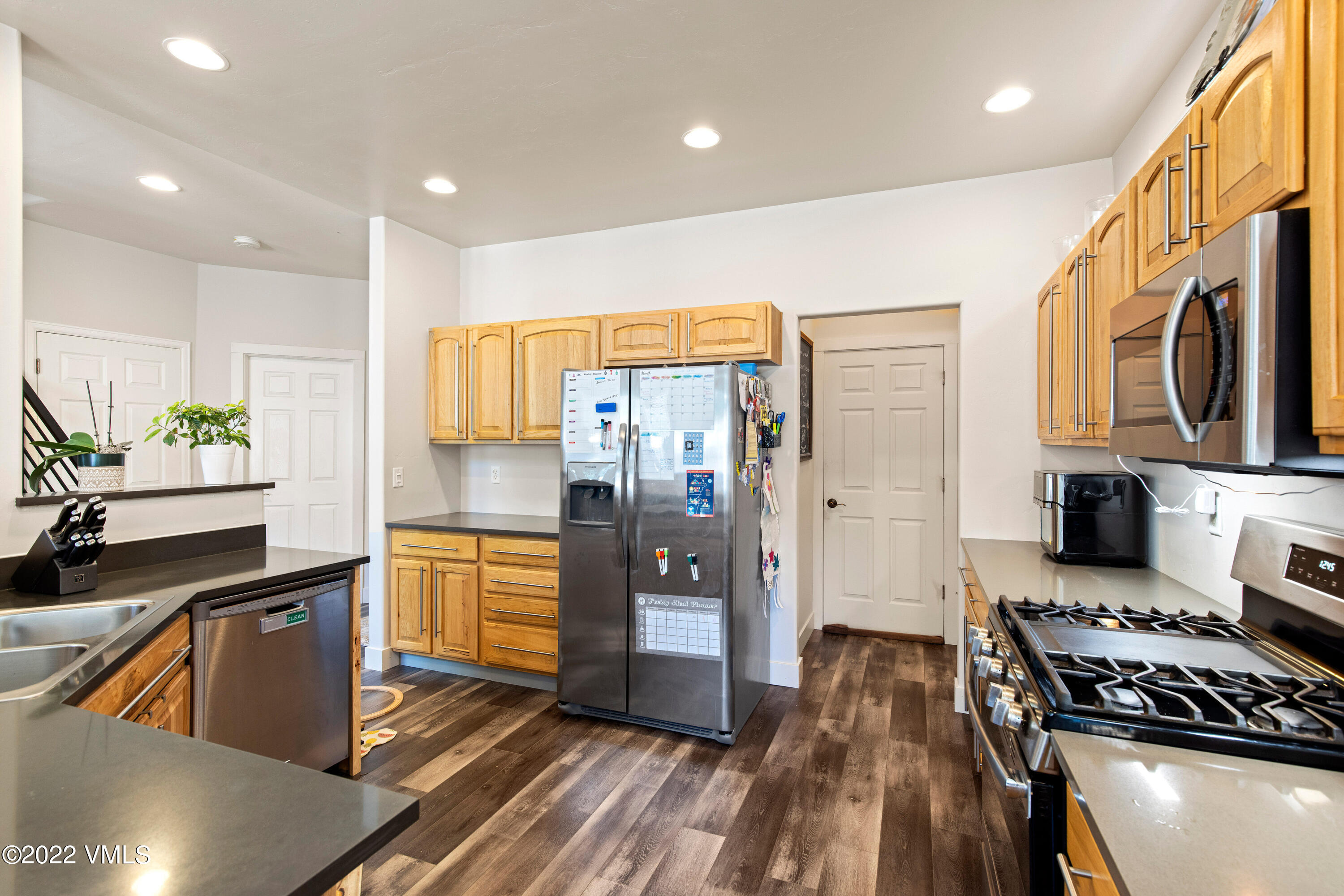 40 Eagle Ranch Road Eagle, CO 81631 - Photo 12 of 38 a kitchen with stainless steel appliances granite countertop a refrigerator and a stove top oven