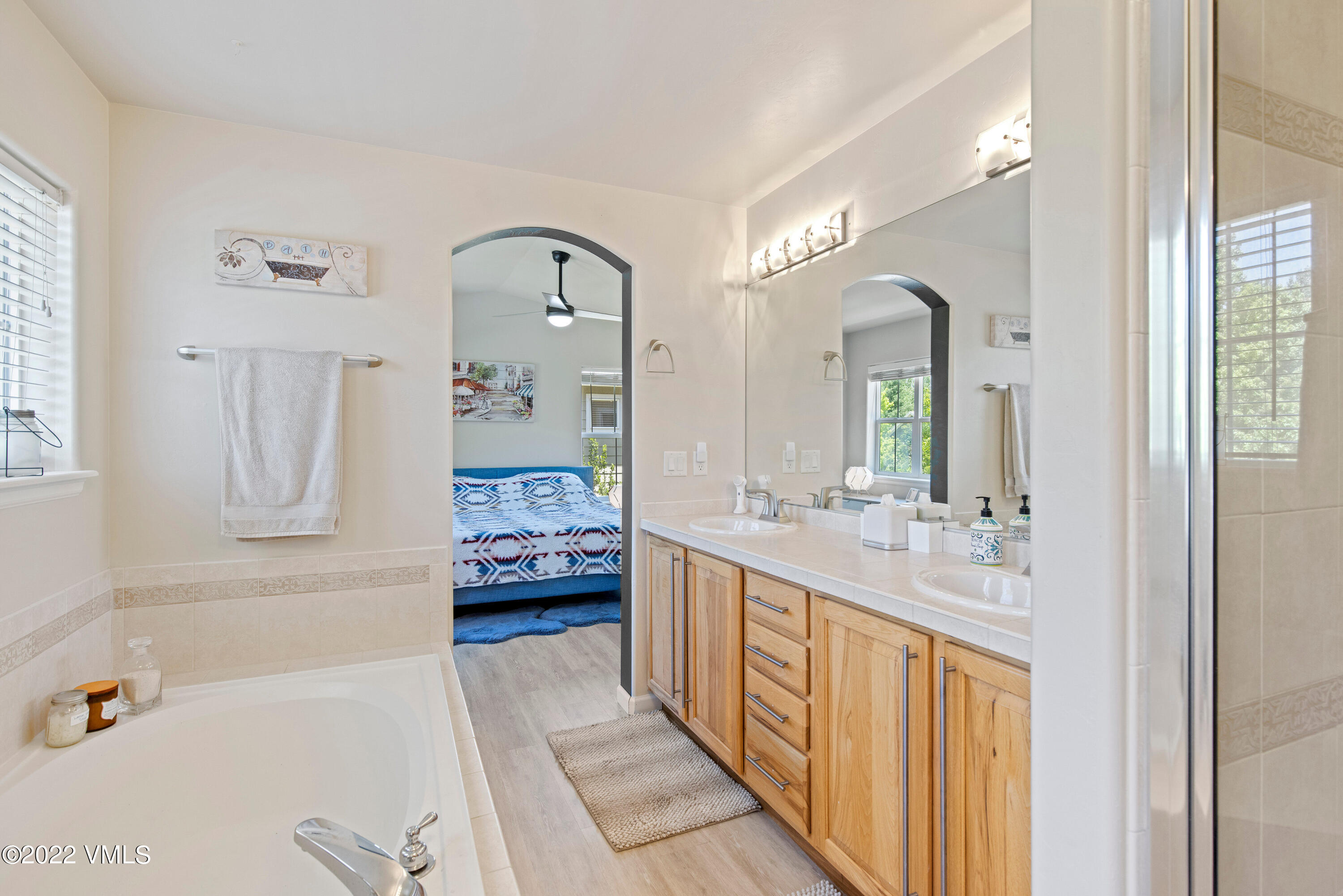 40 Eagle Ranch Road Eagle, CO 81631 - Photo 23 of 38 a spacious bathroom with a tub sink and mirror