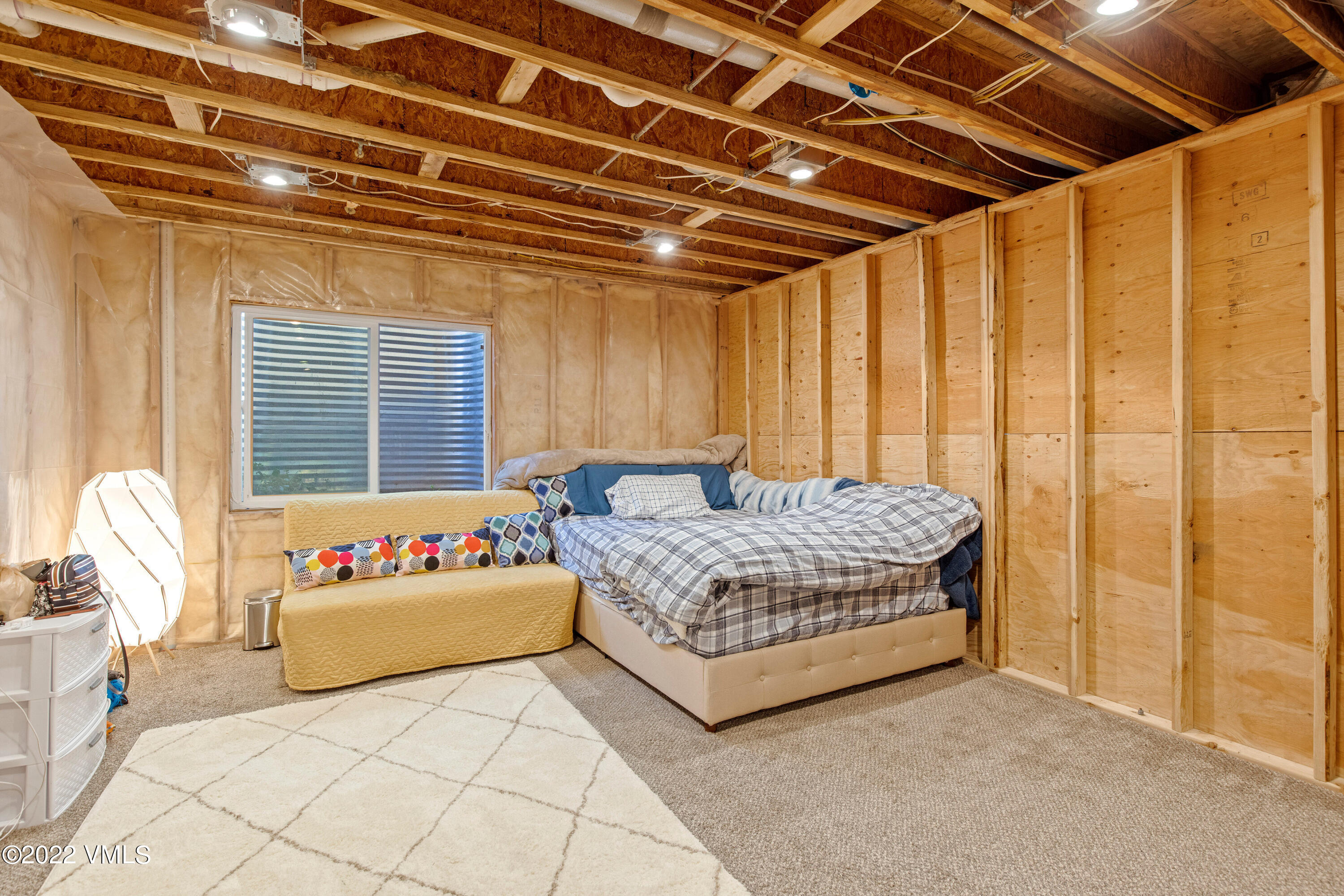40 Eagle Ranch Road Eagle, CO 81631 - Photo 28 of 38 a bedroom with a bed and a table