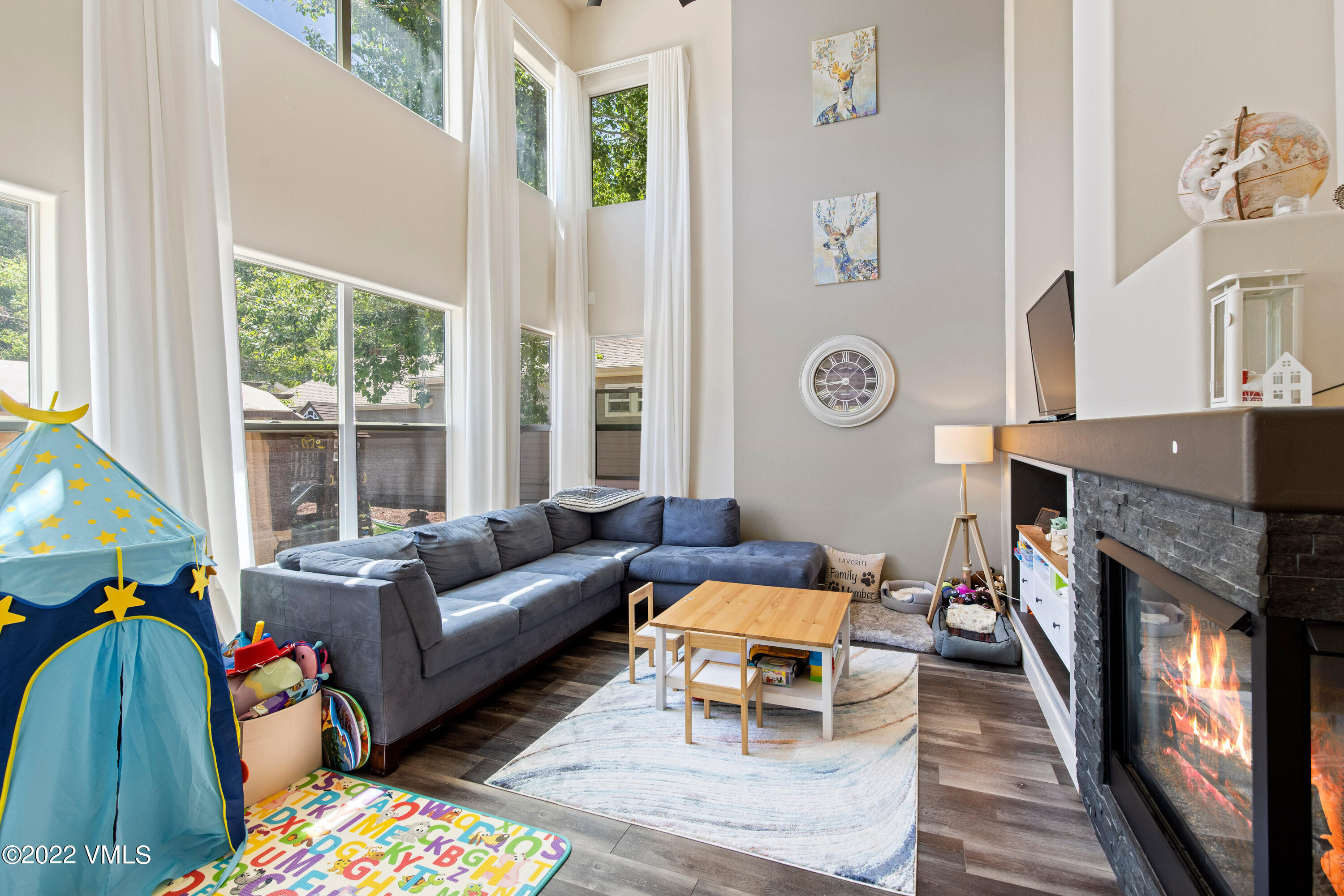 40 Eagle Ranch Road Eagle, CO 81631 - Photo 3 of 38 a living room with furniture a fireplace and a large window