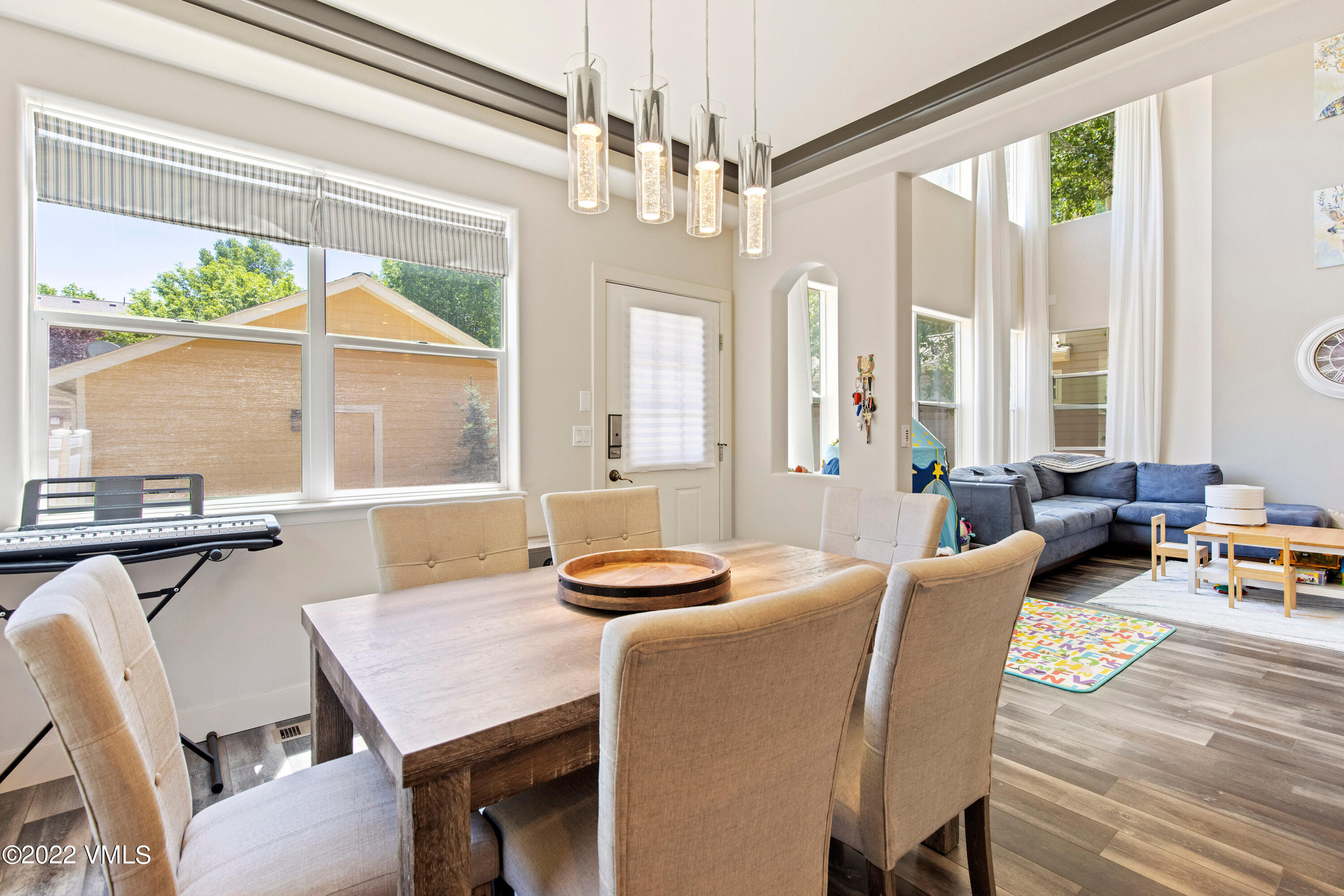 40 Eagle Ranch Road Eagle, CO 81631 - Photo 8 of 38 a dining room with furniture a chandelier and wooden floor