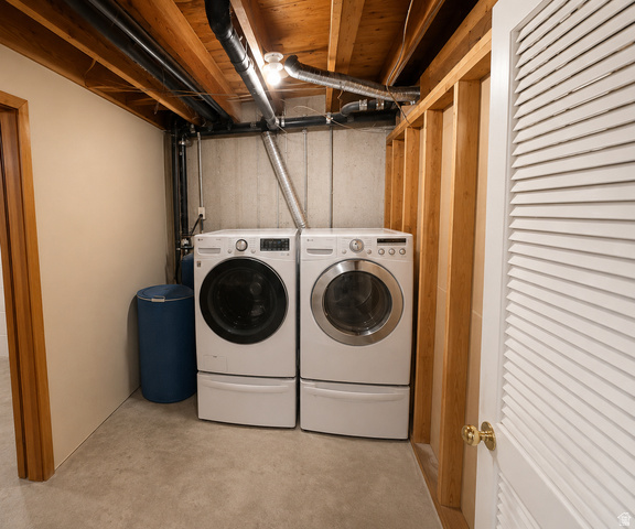 1020 Wilmar Place Centerville, UT 84014 - Photo 17 of 22 Dedicated laundry area featuring front-loading washer and dryer units with pedestal bases
