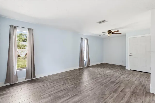 a view of a livingroom with wooden floor