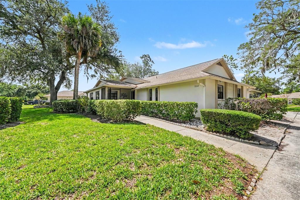 9204 Golf View Drive New Port Richey, FL 34655 - Photo 3 of 33 a front view of a house with a yard