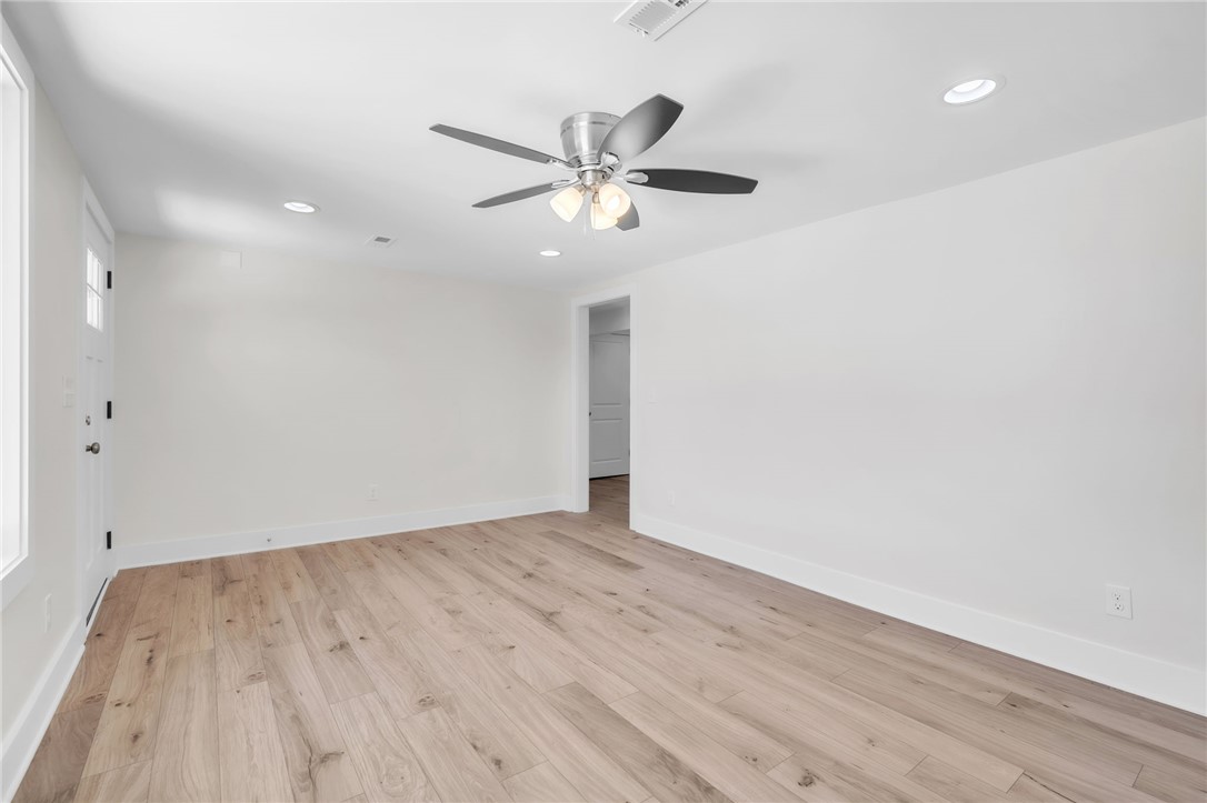 7 Beaverdam Road Williamston, SC 29697 - Photo 23 of 27 LVP floors and bright walls define this welcoming, versatile living space.