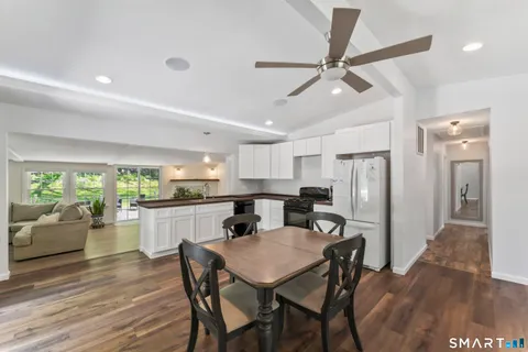 a kitchen with a table and chairs in it